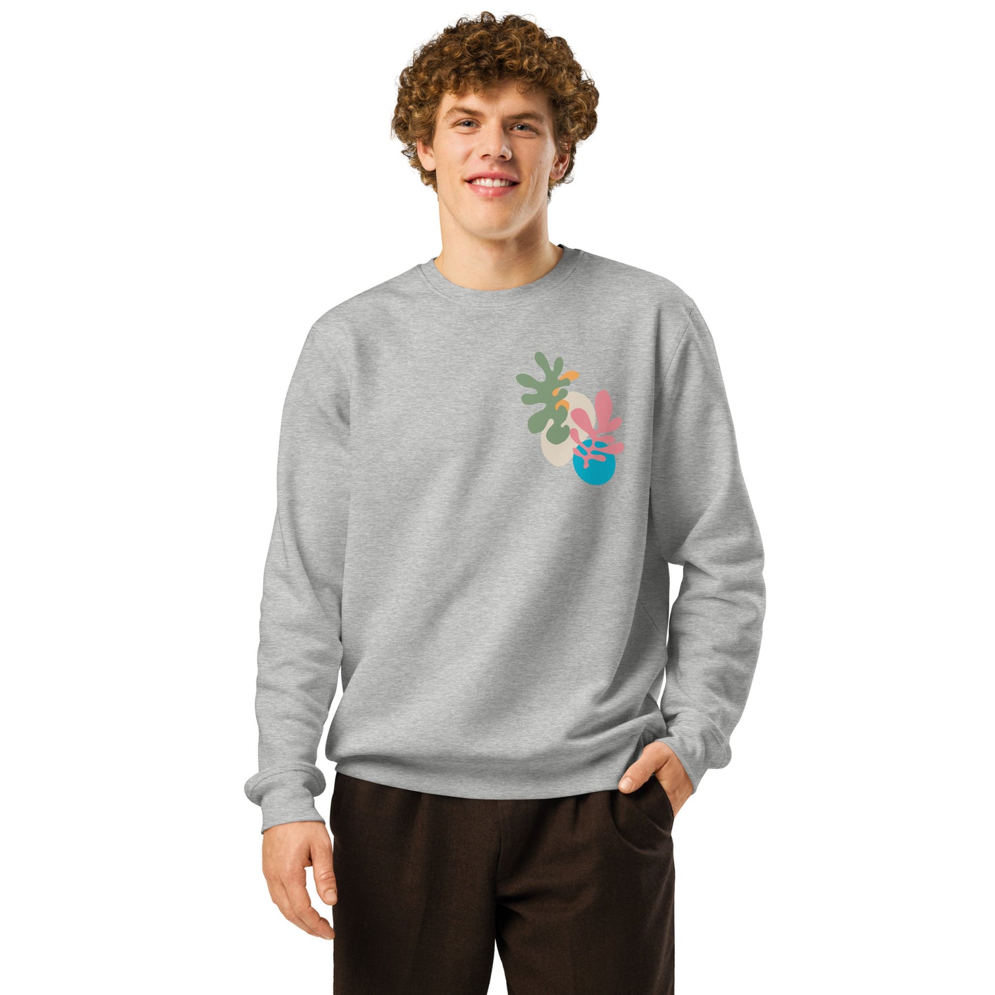 Heather gray sweatshirt featuring minimalist floral abstract chest artwork in pastel hues, on male model