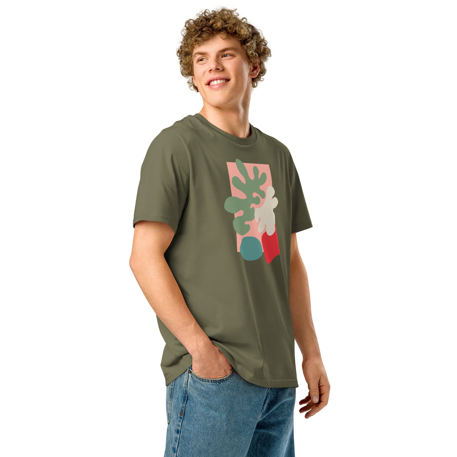 Modern nature-inspired abstract botanical print in red, green, and cream on organic cotton t-shirt On male model.