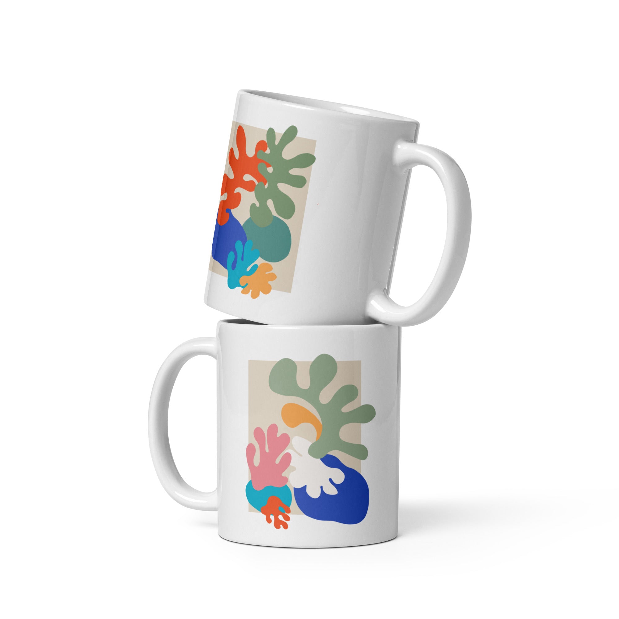 Stacked mugs with bold organic form design, stylish artistic drinkware.
