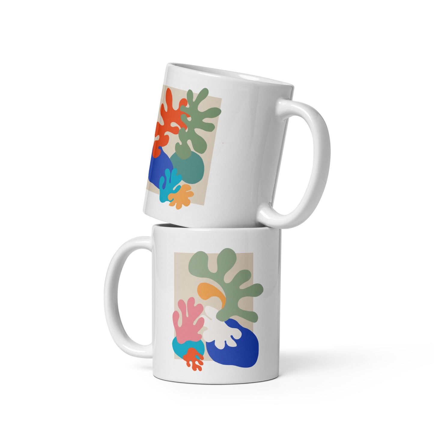 Stacked mugs with bold organic form design, stylish artistic drinkware.