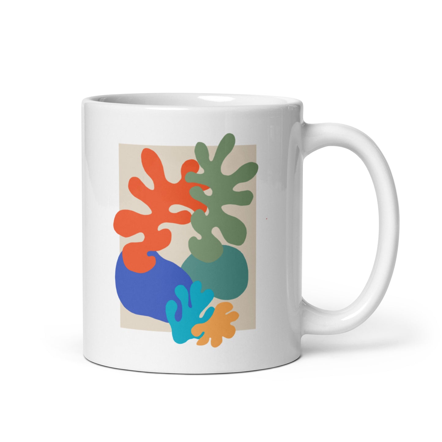 White ceramic mug with colorful abstract botanical shapes, modern coffee cup. Side view 2