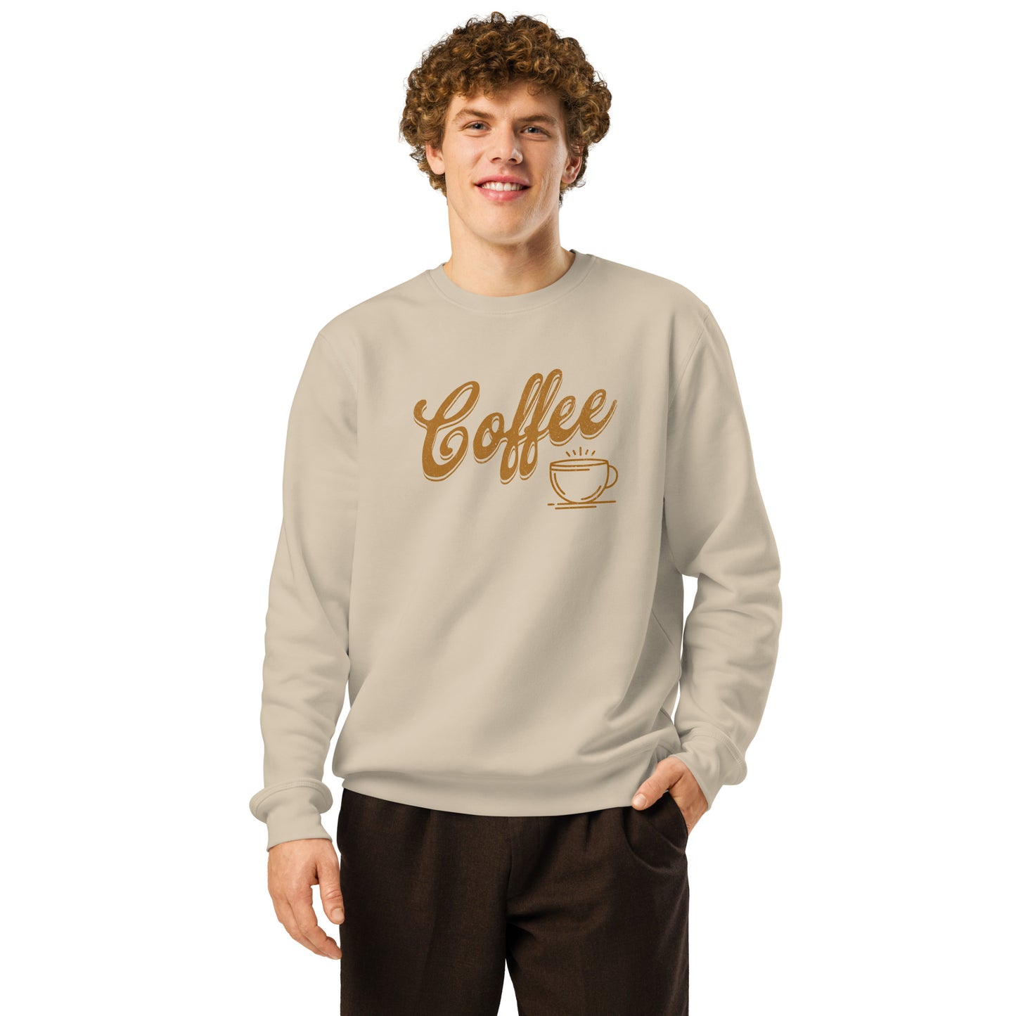 Desert dust-colored unisex sweatshirt featuring bold Coffee typography graphic on model.