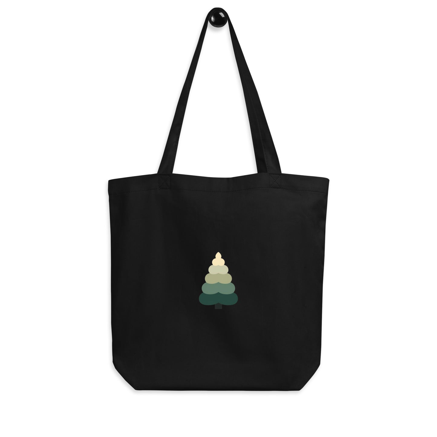 Black eco-friendly tote bag with minimalist layered evergreen tree graphic.
