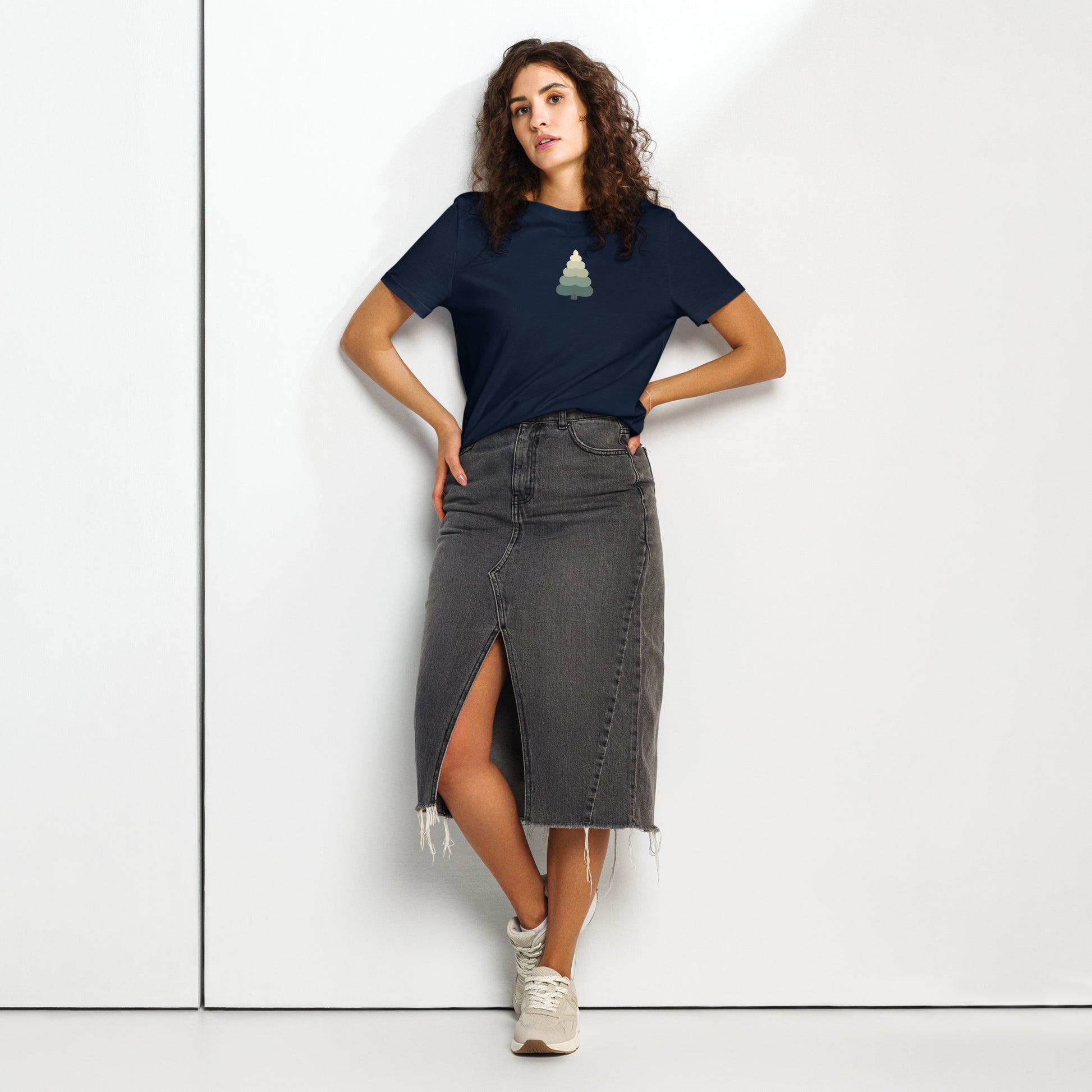 Women’s organic t-shirt with minimalist evergreen tree design on model