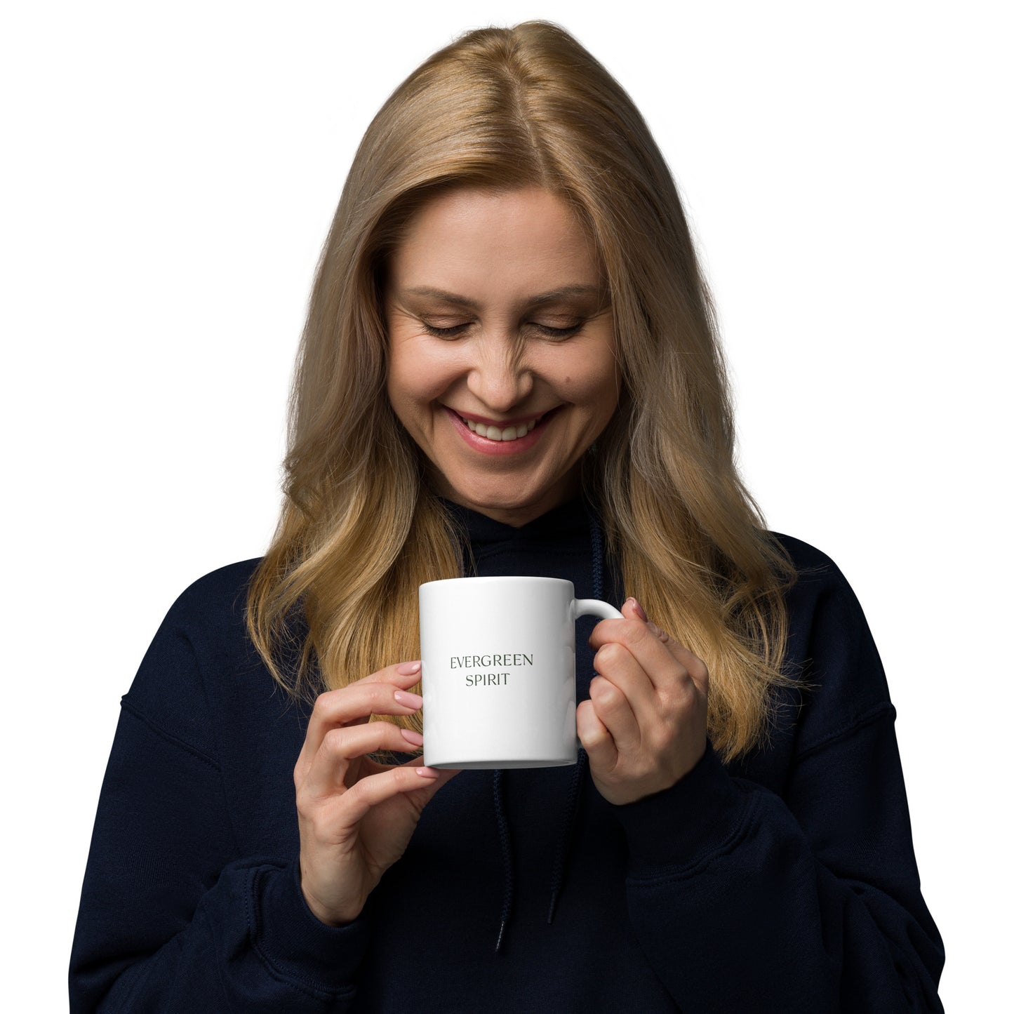 Female model holding a ceramic mug with the words ‘Evergreen Spirit’ in minimalist serif typography.