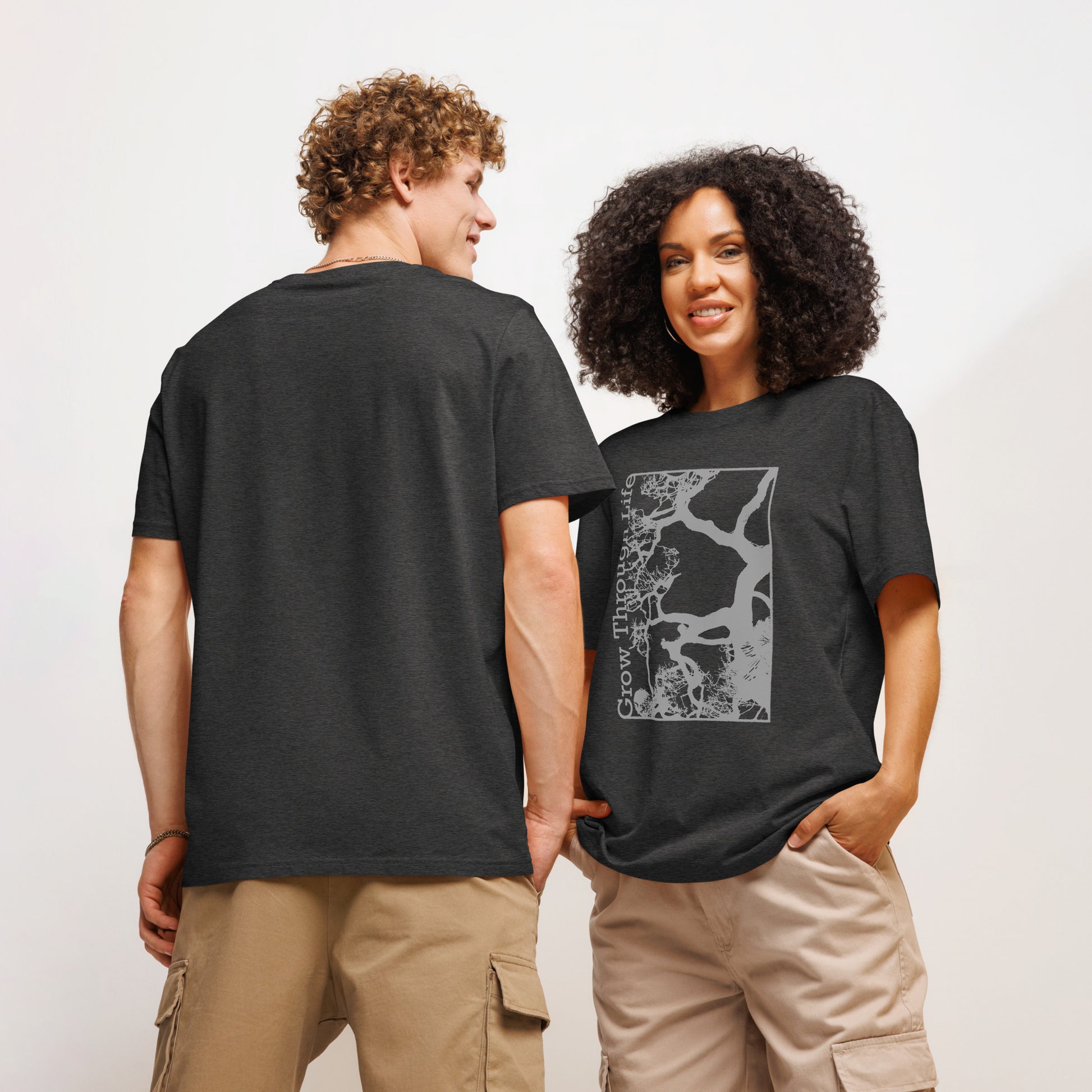 Two people wearing organic t-shirts with Growth Through Life Tree Graphic