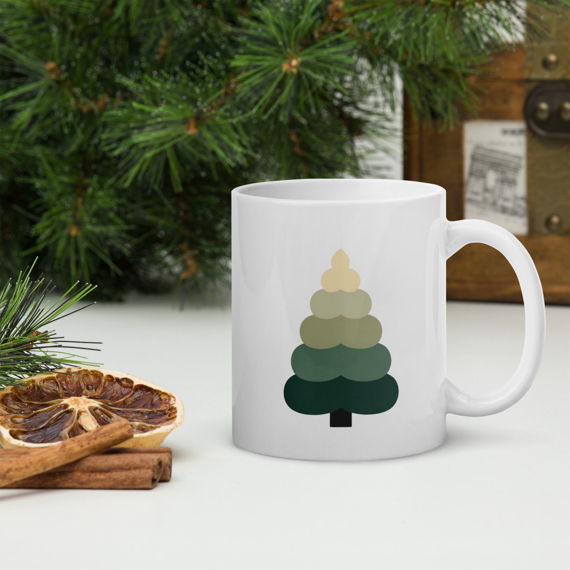 Minimalist evergreen tree design printed on white ceramic mug.