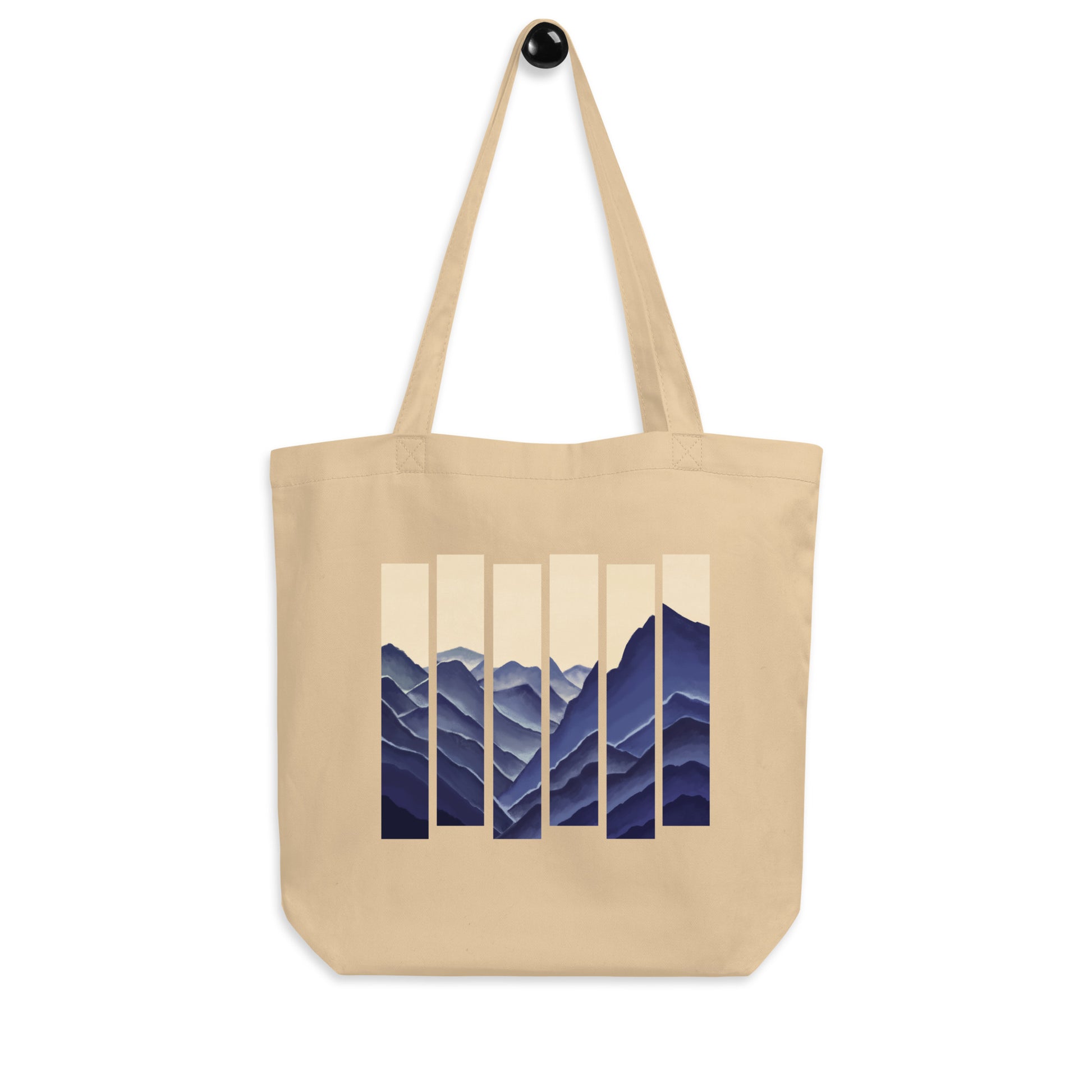 Oyster Eco tote bag with abstract mountain stripe design in blue tones.
