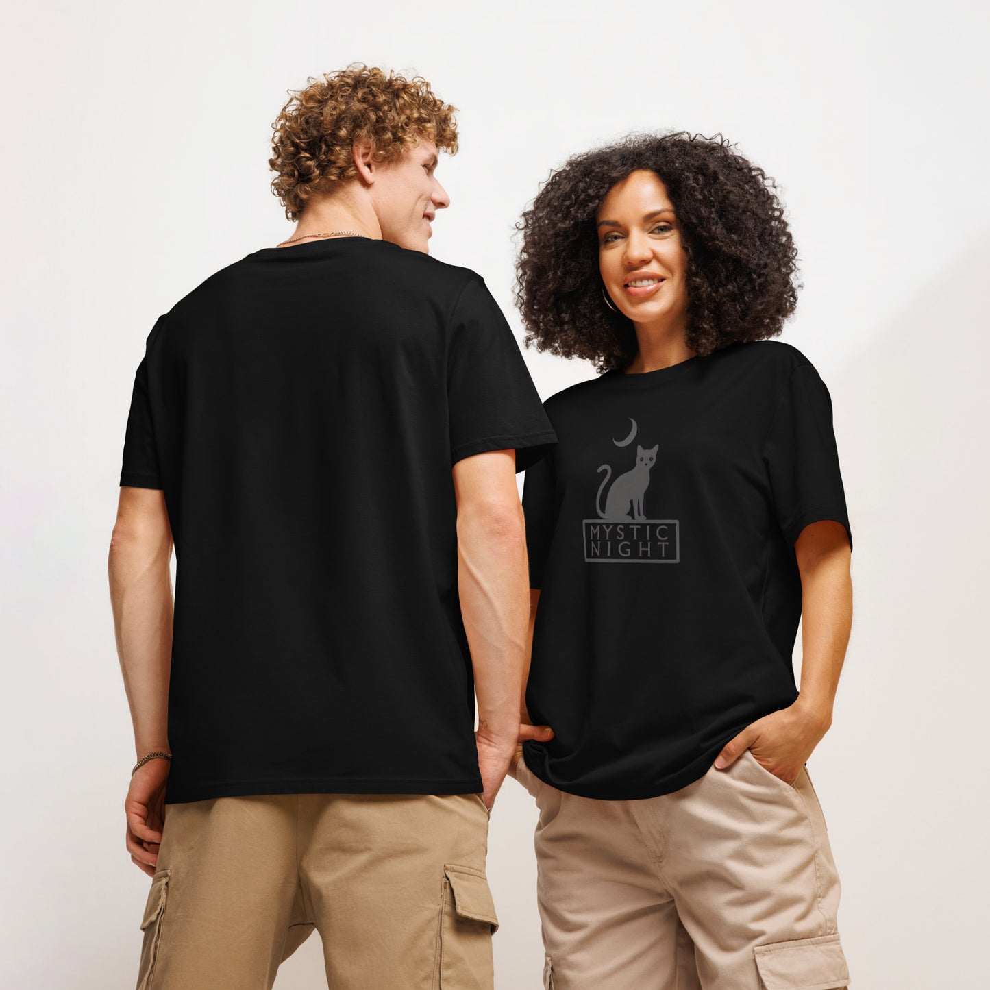 Two people wearing black t-shirts with a cat graphic and 'Mystic Night' text.