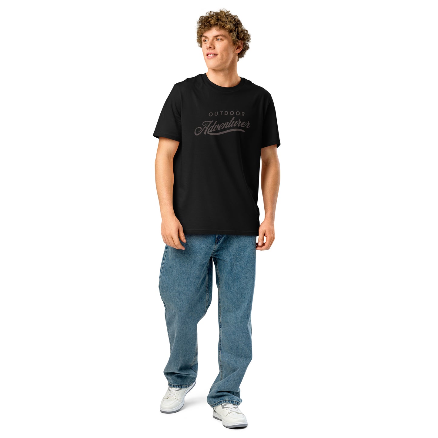 Unisex black organic cotton t-shirt with Outdoor Adventurer graphic on model