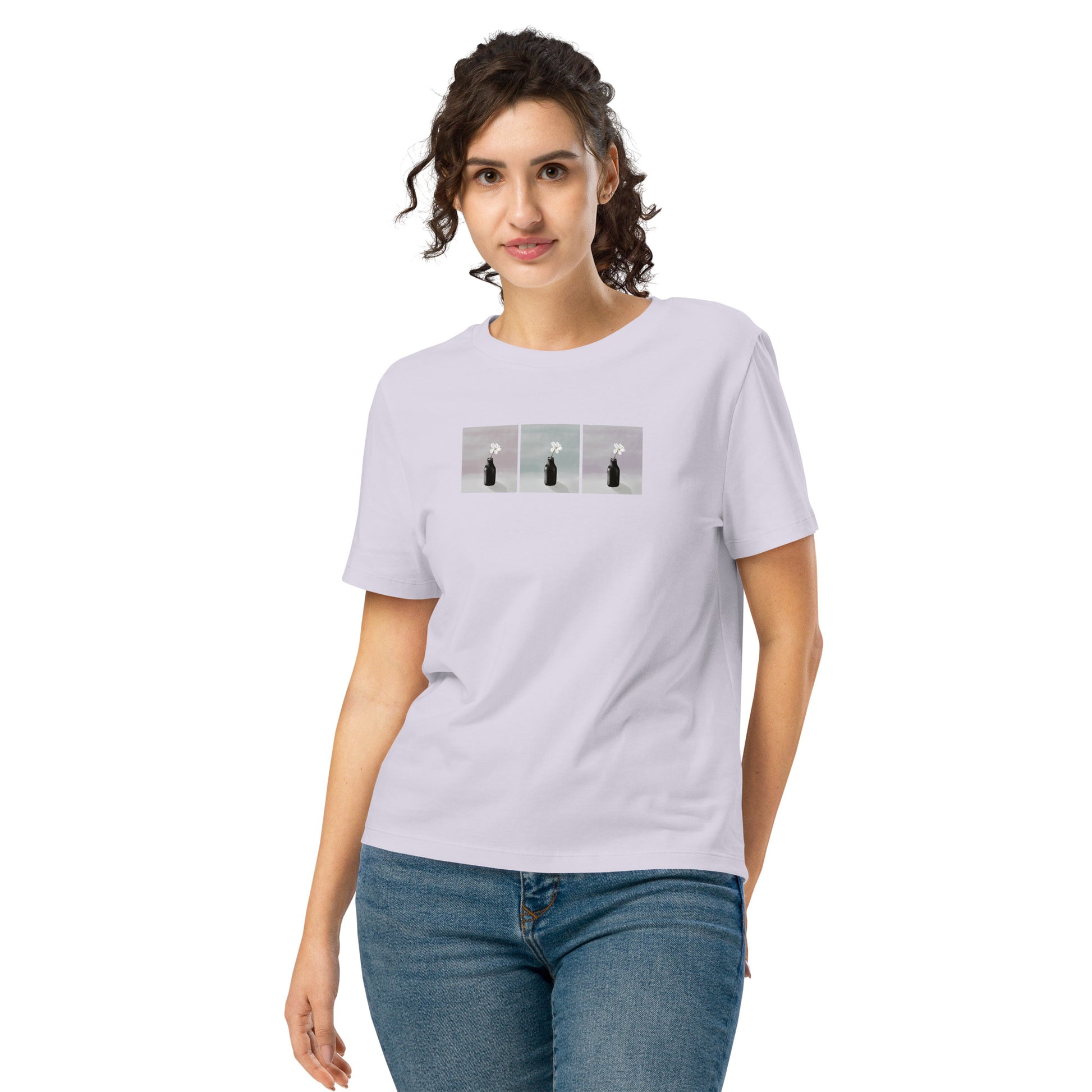 Unisex organic t-shirt featuring artistic three-panel figure in soft, serene tones on model