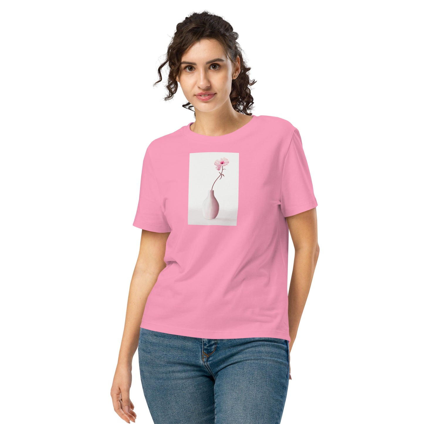 Model wearing women’s organic t-shirt with soft floral vase artwork.
