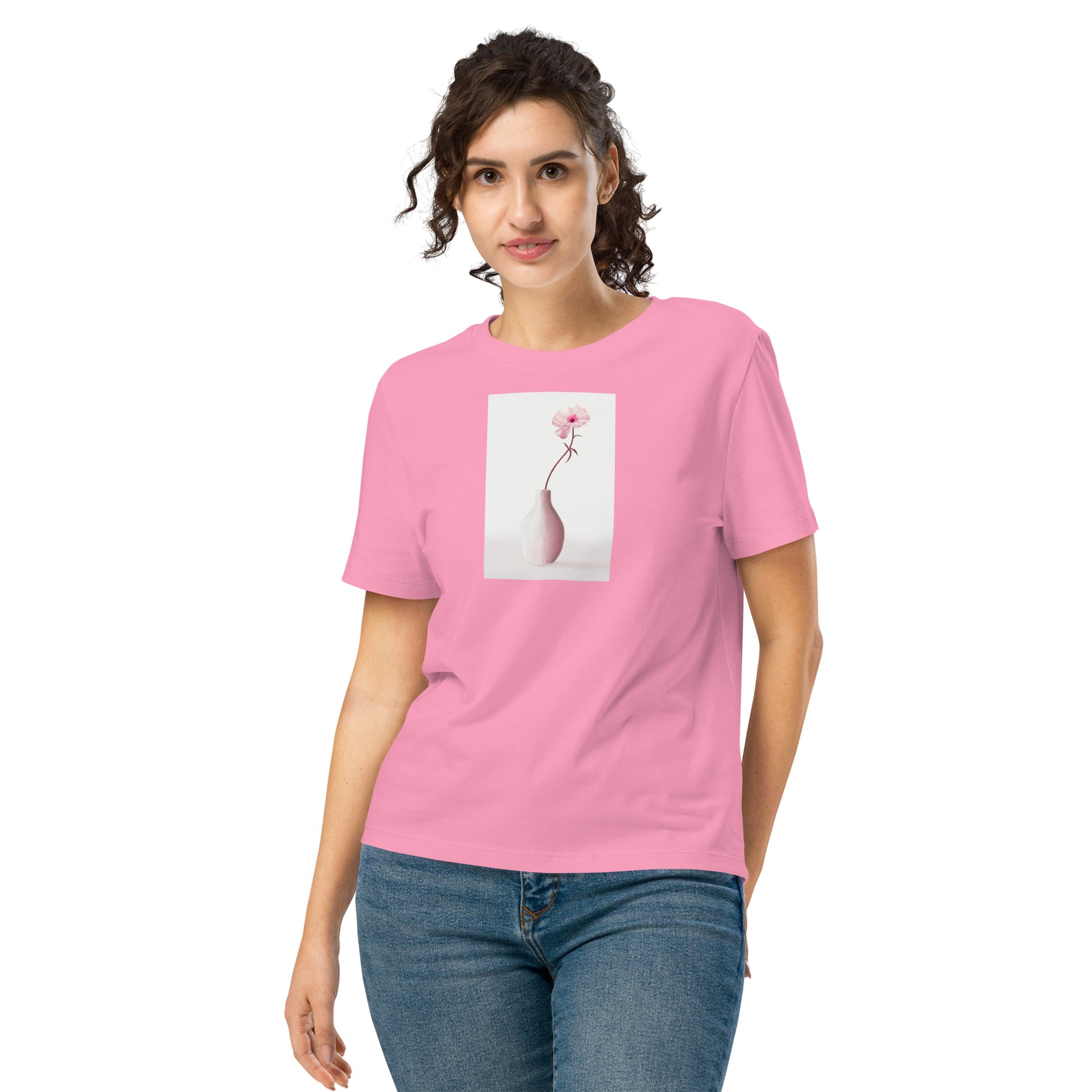 Model wearing women’s organic t-shirt with soft floral vase artwork.